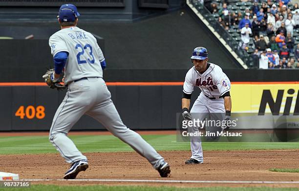 Angel Pagan of the New York Mets heads for third base for a second inning 2 run triple as Casey Blake of the Los Angeles Dodgers waits for the throw...
