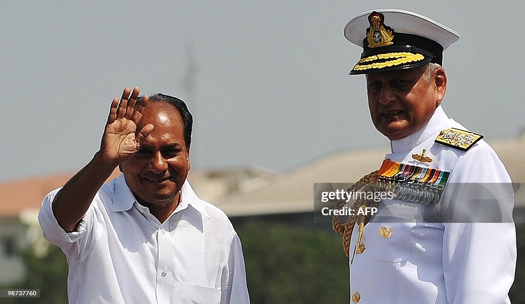 Defence Minister A.K. Antony (L) waves a