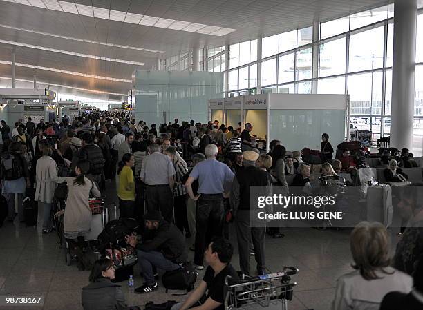 Passengers queue at El Prat Airport in Barcelona on April 18, 2010. Barcelona and 13 other airports in the north of Spain were closed until at least...