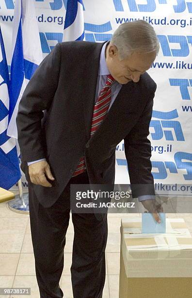 Israeli Prime Minister Benjamin Netanyahu casts his ballot for a proposal to amend the Likud party's constitution at the party's headquarters in Tel...