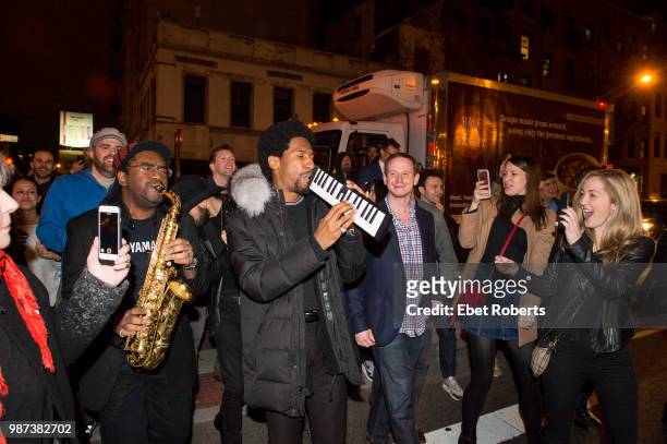 Jon Batiste leads a second line on Delancy Street after his show at the Bowery Ballroom in New York City on February 28, 2018.