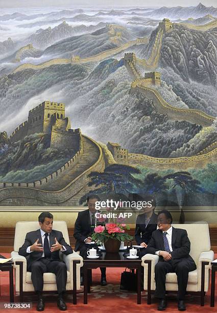 French President Nicolas Sarkozy holds talks to China's top legislator Wu Bangguo , the second highest-ranking figure in the Communist hierarchy,...