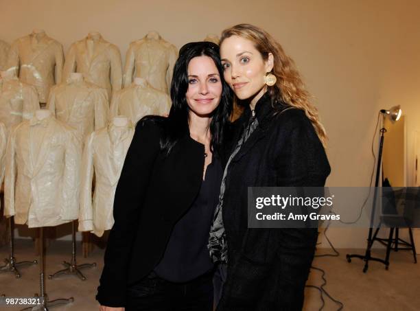 Actresses Courteney Cox Arquette and Elizabeth Berkley attend Greg Lauren Presents Alteration Art on April 28, 2010 in Los Angeles, California.