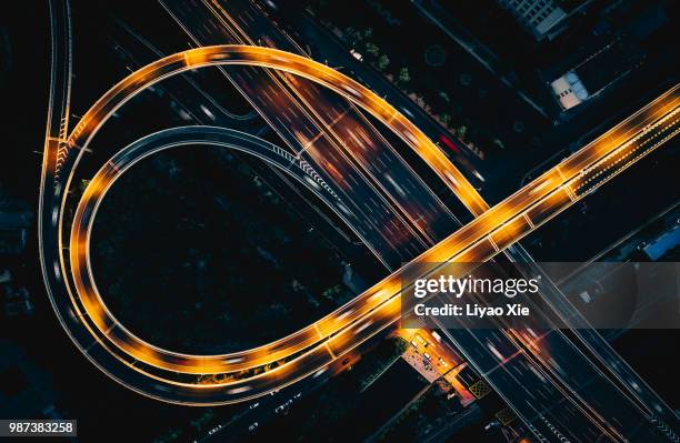 bridge traffic at night - shanghai aerial view motorway skyline stock-fotos und bilder