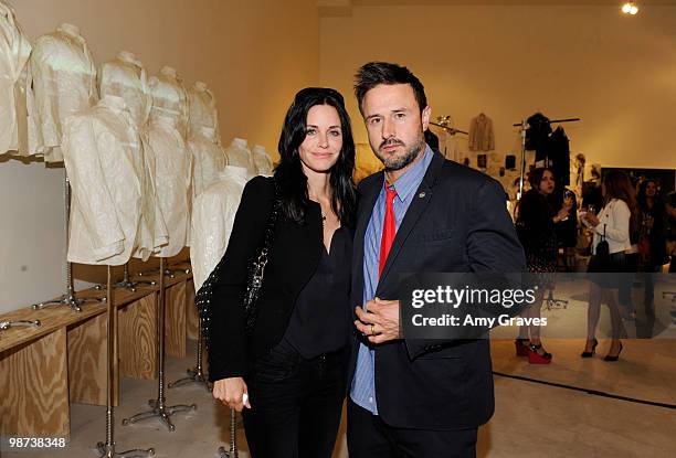 Actors Courteney Cox Arquette and David Arquette attend Greg Lauren Presents Alteration Art on April 28, 2010 in Los Angeles, California.