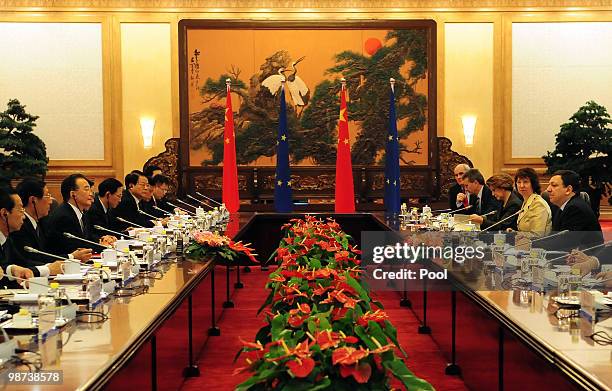 European Commission President Jose Manuel Barroso and his delegation sit down for a meeting with Chinese Premier Wen Jiabao and his delegation during...