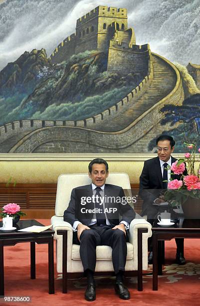 French President Nicolas Sarkozy holds talks to China's top legislator Wu Bangguo , the second highest-ranking figure in the Communist hierarchy, at...