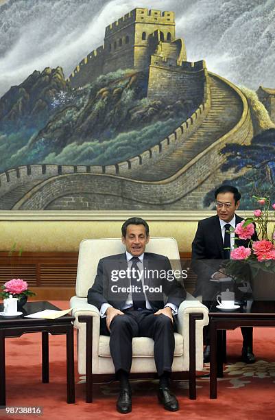 France's President Nicolas Sarkozy holds talks with National People's Congress Standing Committee Chairman Wu Bangguo at the Great Hall of the People...