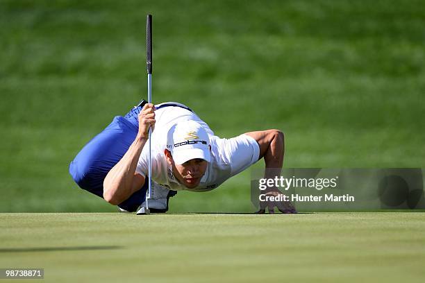 Camilo Villegas lines up a putt during the first round of the Waste Management Phoenix Open at TPC Scottsdale on February 25, 2010 in Scottsdale,...