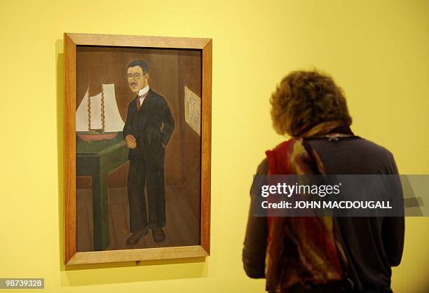 Visitor stands in front of the painting "Portrait of Dr. Leo Eloesser" by Mexican artist Frida Kahlo during a press preview on April 29, 2010 at the...