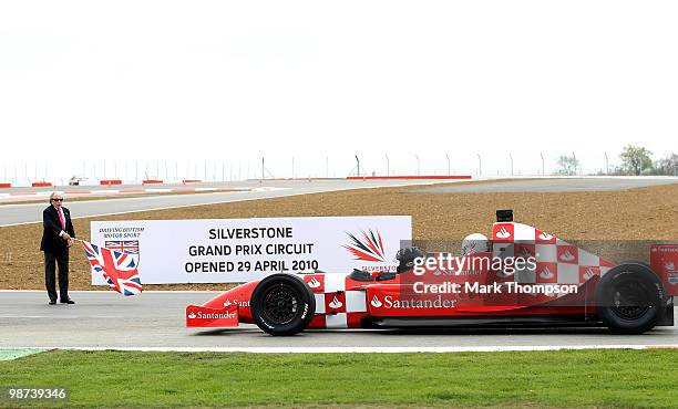 Damon Hill the President of the BRDC takes HRH Prince Andrew, the Duke of York for a few laps in a specially adapted two seater car under starters...