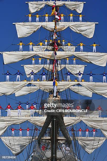 Cadets stand on the Colombian Navy �Tall� sailboat Gloria rigging as they approach their mooring place at the Callao Naval Base in Peru, on April 28,...