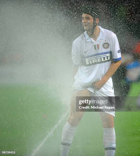 Cristian Chivu of Inter Milan celebrates in the sprinklers after victory in the UEFA Champions League Semi Final Second Leg match between Barcelona...
