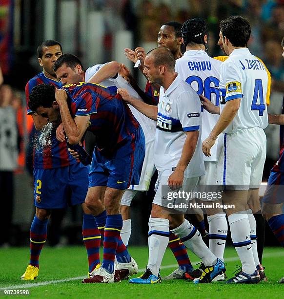 Thiago Motta of Inter Milan argues with Sergio Busquets of Barcelona after being sent off in the UEFA Champions League Semi Final Second Leg match...