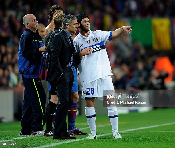 Inter Milan manager Jose Mourinho talks to Cristian Chivu of Inter Milan during the UEFA Champions League Semi Final Second Leg match between...
