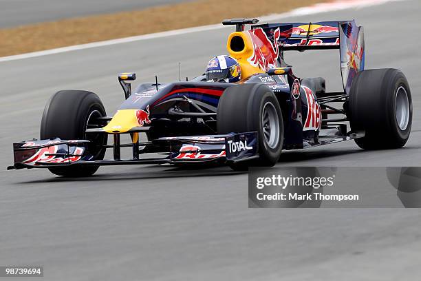 David Coulthard of Great Britain tests out the track in a Red Bull Formula One car during the launch of the new Grand Prix circuit at Silverstone on...