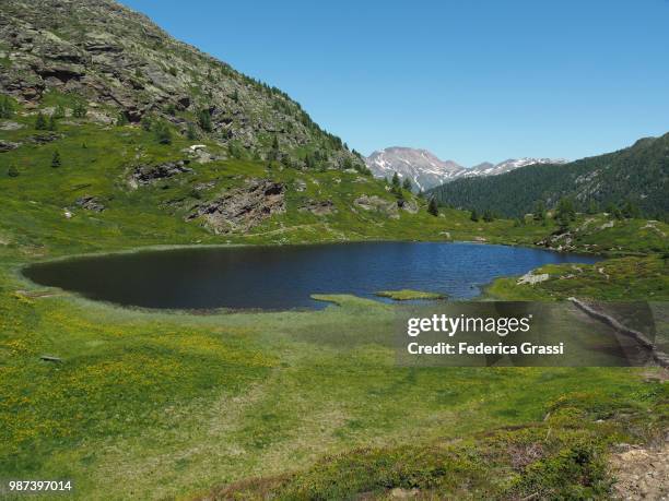 man-made stone firebreak at hopschusee near simplon pass - footpath sign stock pictures, royalty-free photos & images