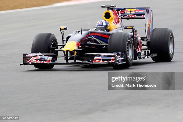 David Coulthard of Great Britain tests out the track in a Red Bull Formula One car during the launch of the new Grand Prix circuit at Silverstone on...