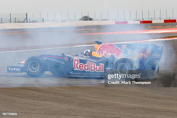 David Coulthard of Great Britain wheelspins out on the track in a Red Bull Formula One car during the launch of the new Grand Prix circuit at...