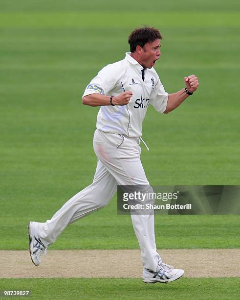 Neil Carter of Warwickshire celebrates after taking the wicket of Michael Carberry of Hampshire during the LV County Championship match between...