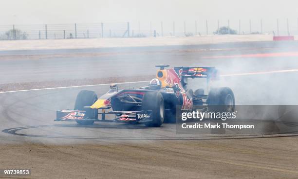 David Coulthard of Great Britain wheelspins out on the track in a Red Bull Formula One car during the launch of the new Grand Prix circuit at...