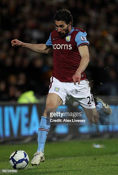 Carlos Cuellar of Aston Villa runs with the ball during the Barclays Premier League match between Hull City and Aston Villa at the KC Stadium on...