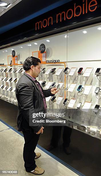 Hamaad Turekman shops for a mobile phone at a France Telecom SA Orange mobile phone shop in Paris, France, on Tuesday, April 27, 2010. France Telecom...
