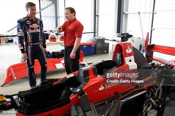 David Coulthard gets a run through on a specially converted two seater car during the launch of the new Grand Prix circuit at Silverstone on April...