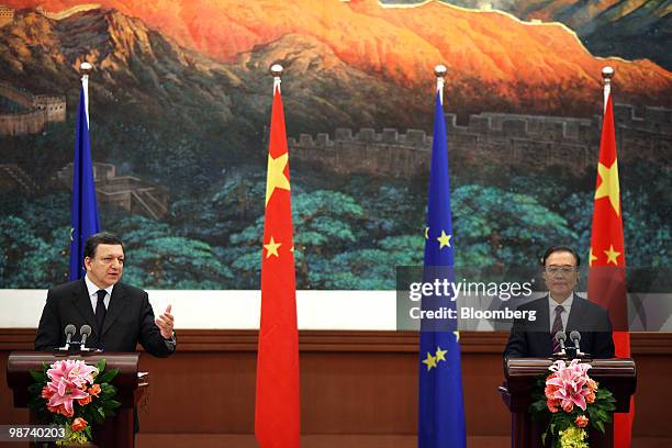 Jose Manuel Barroso, president of the European Commission, left, speaks as Wen Jiabao, China's premier, listens during their joint news conference in...