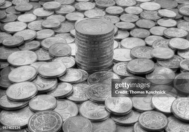 euro cents and german euro in the middle - bringing home the bacon stock pictures, royalty-free photos & images