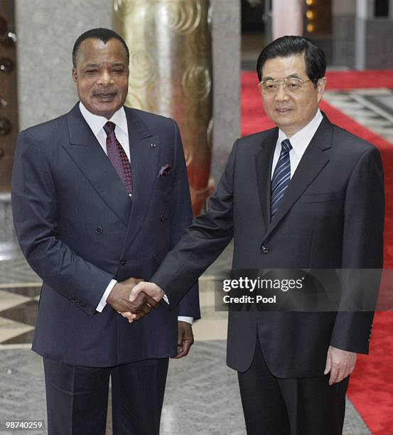 Chinese president Hu Jintao shakes hands with Republic of Congo President Denis Sassou Nguesso prior to their meeting on April 29, 2010 in Shanghai,...