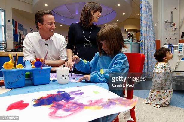 Britain's opposition Conservative Party leader David Cameron and his wife Samantha visit the Children's hospital on April 29. 2010 in Birmingham,...
