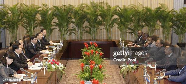 Chinese president Hu Jintao meets with Republic of Congo President Denis Sassou Nguesso on April 29, 2010 in Shanghai, China