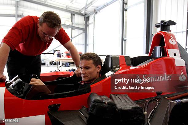 David Coulthard gets a run through on a specially converted two seater car during the launch of the new Grand Prix circuit at Silverstone on April...