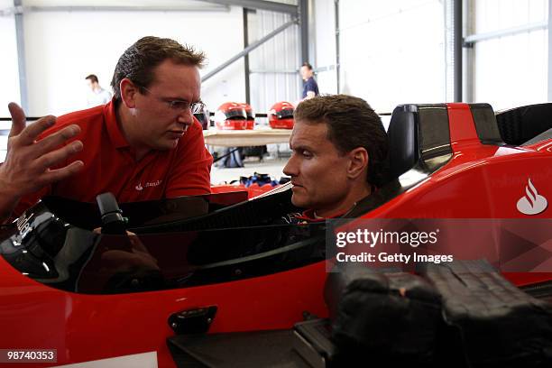 David Coulthard gets a run through on a specially converted two seater car during the launch of the new Grand Prix circuit at Silverstone on April...