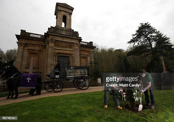 Arnos Vale gardeners plant a yew tree to commemorate the official re-opening of Arnos Vale cemetery on April 29, 2010 in Bristol, England. Described...