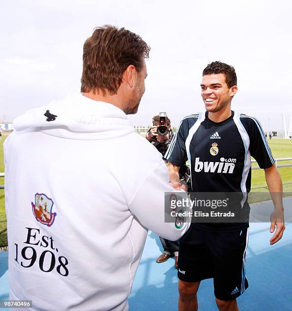 Actor Russell Crowe greets Pepe of Real Madrid during a visit to Valdebebas on April 29, 2010 in Madrid, Spain.