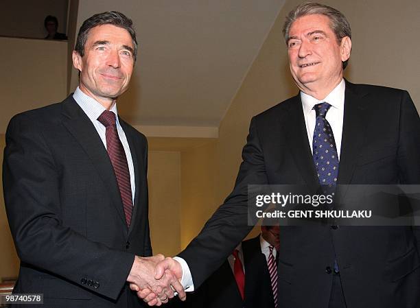 Albania's Prime Minister Sali Berisha welcomes NATO Secretary-General Andres Fogh Rasmussen prior to their meeting in Tirana on April 29, 2010....