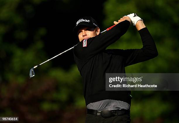 Nick Watney tee's off at the 13th during the first round of the Quail Hollow Championship at Quail Hollow Country Club on April 29, 2010 in...