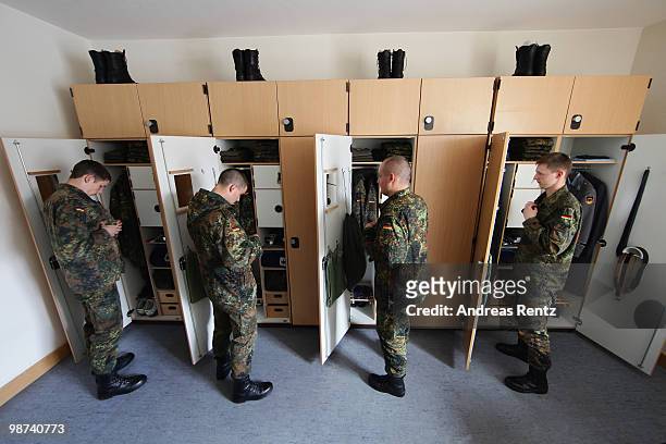 Young recruits of the German Bundeswehr get dressed in their living room during their nine months military service at the Julius Leber barracks on...
