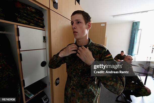 The young recruit Schirmer of the German Bundeswehr gets dressed in his living room during his nine months military service at the Julius Leber...