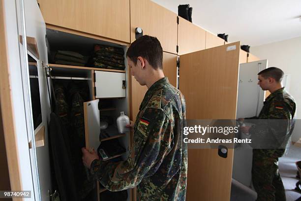 Young recruits of the German Bundeswehr get dressed in their living room during their nine months military service at the Julius Leber barracks on...