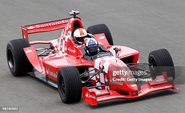 David Coulthard takes out Martin Brundle for a few laps in a specially converted two seater car during the launch of the new Grand Prix circuit at...