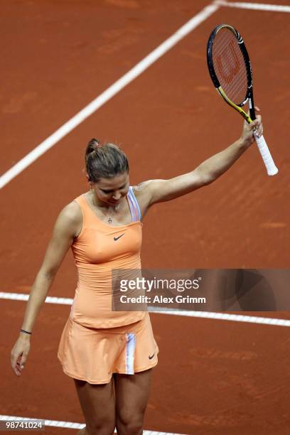 Lucie Safarova of Czech Republic reacts after winning her second round match against Caroline Wozniacki of Denmark at day four of the WTA Porsche...