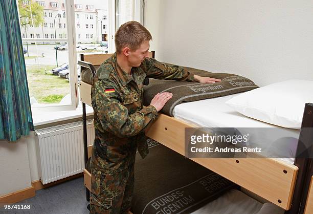 The young recruit Gaburek of the German Bundeswehr tidies up his bed in his living room during his nine months military service at the Julius Leber...
