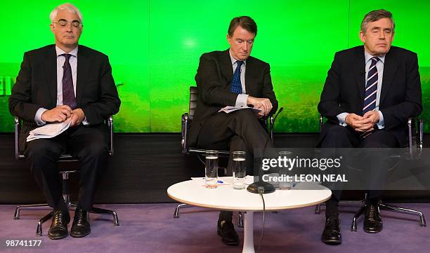 British Business Secretary Peter Mandelson, Chancellor of the Exchequer Alistair Darling and Prime Minister Gordon Brown speak to members of the...