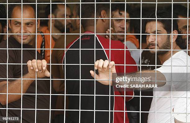 Iraqi prisoners wait for their release at at Al-Rusafa detention facility in Baghdad on April 29, 2010. About 120 prisoners were set free at...