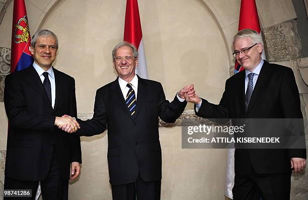 Presidents, Boris Tadic of Serbia, Laszlo Solyom of Hungary and Ivo Josipovic of Croatia pose for a family photo hand in hand at the Museum of the...