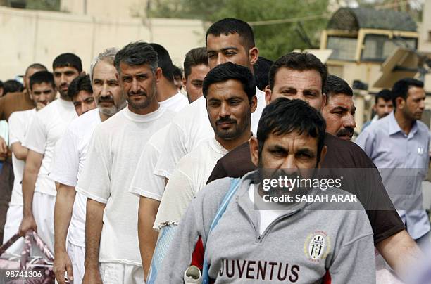 Iraqi prisoners queue before their release from Al-Rusafa detention facility in Baghdad on April 29, 2010. About 120 prisoners were set free at...