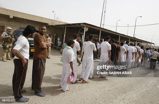 Iraqi prisoners queue before their release from Al-Rusafa detention facility in Baghdad on April 29, 2010. About 120 prisoners were set free at...